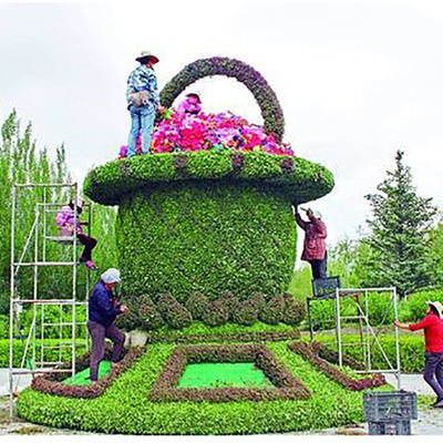 大型户外仿真动物绿雕造型园林景观城市创意孔雀开